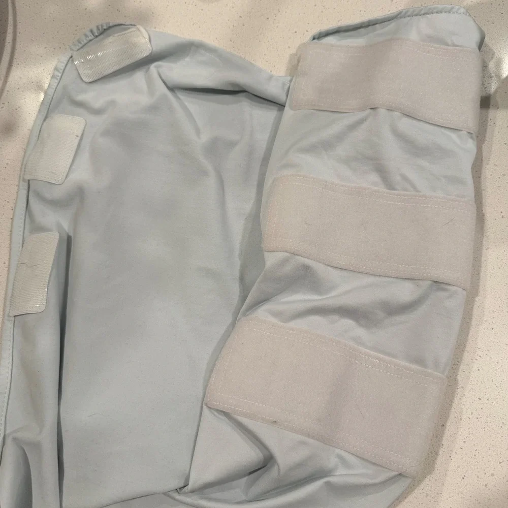 The Ollie Swaddle Adjustable Baby‎ Wrap Light Blue Moisture Wicking Jersey